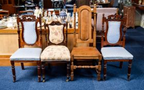 A Collection Of Four Dining Chairs To include two carved back dining chairs with blue jacquard