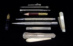 A Collection of Antique Penknives and Propelling Pencils. some silver and some plate.