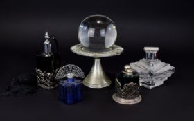 A Spherical Glass Globe On Pewter Tone Stand With Zodiac Design Transparent glass sphere on footed