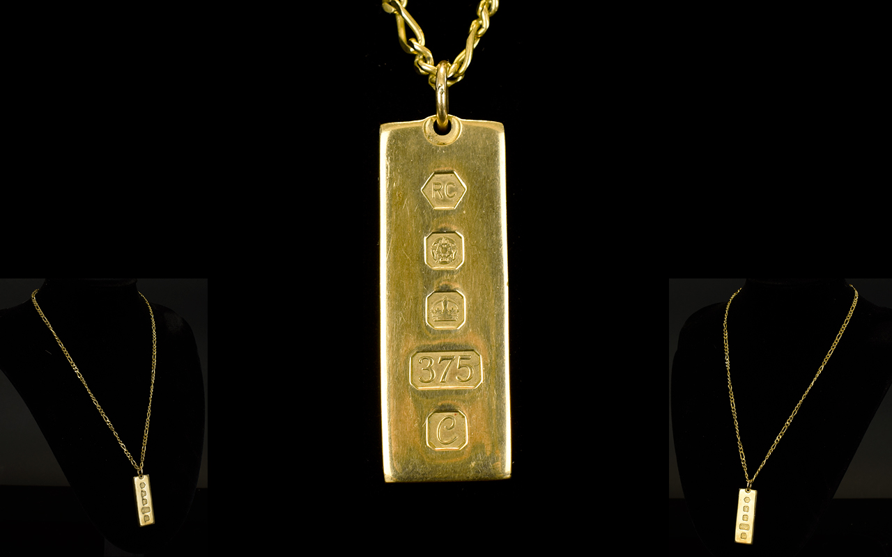 9ct Gold Hallmarked 1 oz Gold Ingot, Attached to a 9ct Gold Curb Chain Marked 9ct Gold.