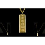 9ct Gold Hallmarked 1 oz Gold Ingot, Attached to a 9ct Gold Curb Chain Marked 9ct Gold.