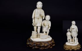 Japanese Late 19th / Early 20th Century Carved Ivory Figure Group of Father and Son Woodcutter with