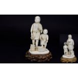 Japanese Late 19th / Early 20th Century Carved Ivory Figure Group of Father and Son Woodcutter with