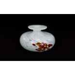 A Studio Art Glass Squat Bud Vase Small vase in white confetti glass with organic ochre and orange