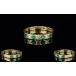 Ladies 9ct Gold Emerald and Diamond Set Seven Stone Dress Ring. Set with 4 Emerald and 3 Diamonds.