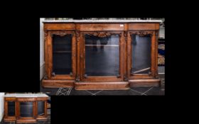 Late Victorian Rosewood Credenza three frieze drawers above glass doors, plinth base, marble top.