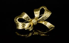 18ct Gold Bow Brooch. Polished and Bark Effect Finish to Brooch. Fitted and Bark Effect Finish to