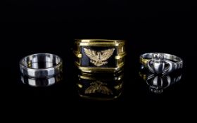 A Franklin Mint Silver, Onyx And 14ct Gold Eagle Ring In As New Condition, the retail price £200.