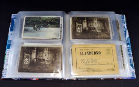 An Album Containing an Assortment of Postcards,