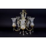 A Large Chandelier Five arm chandelier in brass tone with five fluted ,