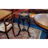 Antique Plant Stand Fashioned in ebonised wood with trefoil legs, carved,