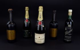 Five Bottles of Vintage Alcohol comprising Moet & Chandon Bottle of Champagne one dated 1980,