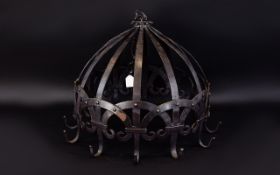 A Large Reproduction Medieval Cast Iron Chandelier Large cage style ceiling fitting with twelve