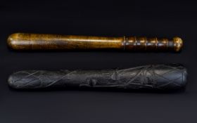 A Pair Of Carved Wood Truncheons/Cosh Two items in total to include turned wood truncheon and Irish