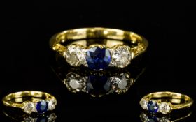 18ct Yellow Gold Sapphire and Diamond Set 3 Stone Ring. The Central Sapphire Est Weight 50 pts.