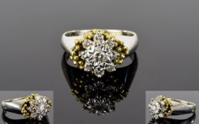 18ct Gold Set Diamond Cluster Ring. Flower head Setting, The Central Diamond Surrounded by a Further