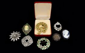 A Collection Of Vintage Costume Jewellery Brooches Eight items in total to include,