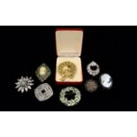 A Collection Of Vintage Costume Jewellery Brooches Eight items in total to include,