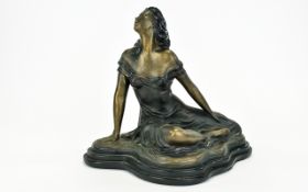 An Austin Sculpture By Alice Heath Bronzed figure in the form of a seated female swathed in a