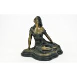 An Austin Sculpture By Alice Heath Bronzed figure in the form of a seated female swathed in a