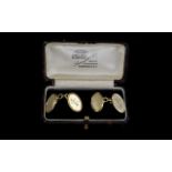 Art Deco Period 9ct Gold - Pair of gentleman's cuff links of oval shape and solid form. Hallmark