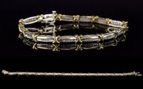 A Contemporary Designed Two Tone 9ct Gold Diamond Set Bracelet. Fully Hallmarked.