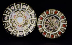 Two Royal Crown Derby Plates Decorative plates in traditional Imari pattern with gilt trim.