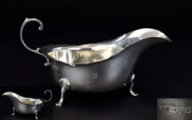 An Early 20th Century Silver Sauce Boat with Swan Neck Handle, Raised on Hoof Feet.