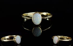 18ct Gold Set Single Stone ( Oval Shaped Opal )Dress Ring. The Opal of Very Pale Colour.