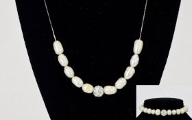 Ladies Pearl And Crystal Bead Necklace And Bracelet Set Contemporary necklace on fine silver tone