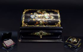 A Victorian Paper Mache Mother-of-Pearl Inlaid Letter Box With serpentine hinged lid and four inner