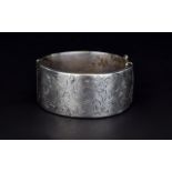 Elizabeth II Wide Hinged Silver Bangle with Stylish Floral Engraving to Front Panel.