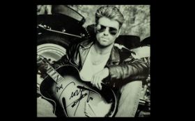 George Michael Autograph on 10 x 8 Black & White Publicity Photograph.