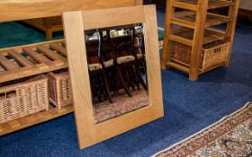 A Contemporary Oak Framed Mirror Golden oak mirror with deep frame of plain form, very good,