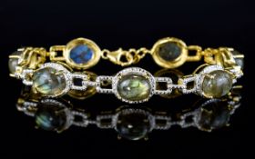 Labradorite Cabochon Line Bracelet, 33cts of labradorite, the enigmatic gemstone with the inner blue