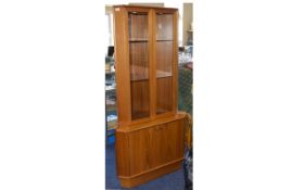 A 1970's Teak Display Cabinet By Turnbridge Corner cabinet with glazed top doors, piano hinges,