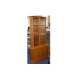 A 1970's Teak Display Cabinet By Turnbridge Corner cabinet with glazed top doors, piano hinges,