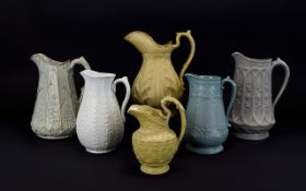 Six Various 19thC Stylised Flower and Leaf Moulded Jugs including two diverse grey jugs with panels,