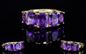 Amethyst Five Stone Band Ring, the central stone of 1.25cts flanked by two further graduated