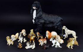 A Collection of 17 Dog Figures, various breeds and sizes, Includes Spaniel, Dalmation,