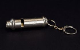 Police Whistle A small silver tone whistle with attached chain and key ring detail.