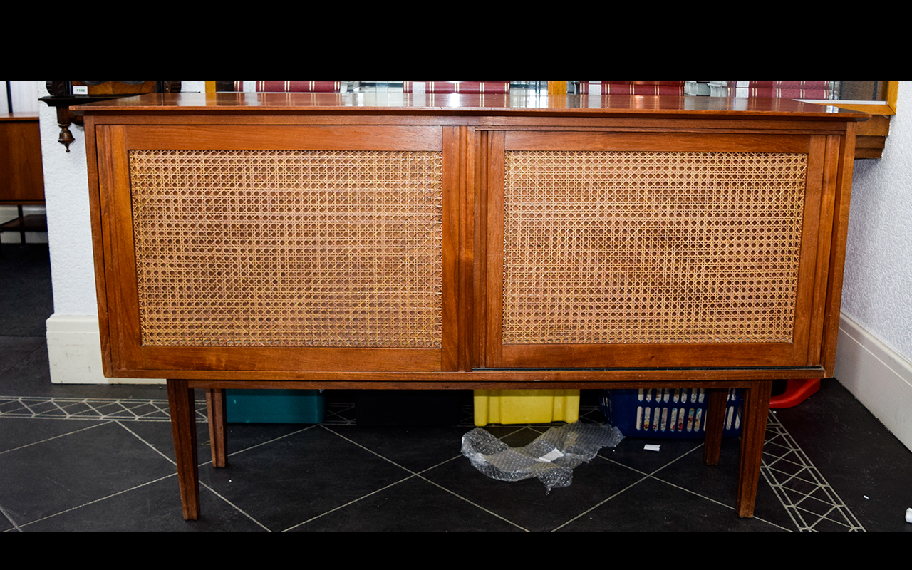 A 1960's Teak Sideboard Long sideboard/buffet with internal drawers, shelves and sliding front doors