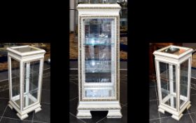 An Ornate Glazed And Mirrored Rectangular Display Cabinet In The French Style. Finished in cream