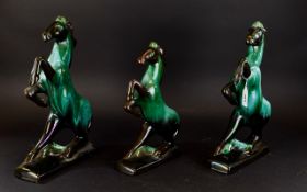 A Collection Of Green/Black Blue Mountain Horse Ceramic Figures comprising of two large and one