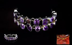 A Contemporary Silver And Amethyst Statement Bracelet Chunky silver bracelet set with 24 large