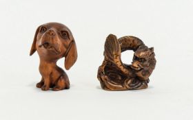 Contemporary Carved Netsuke Two in total, fashioned in dark wood the first in the form of a coiled