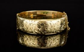 Edwardian Period 9ct Gold / Metal Core Hinged Bangle with Safety Chain.