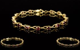 Ladies 10ct Gold Garnet Set Bracelet, Marked 10kt. Set with 15 Garnets, Good Safety Clasp.