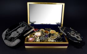 A Jewellery Box Containing A Large Collection Of Brooches Purple velvet hinged box with gilt trim