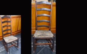 American, Wooden, Early 19th Century Ladderback Armless Rocking Chair with Woven Rush Seat. In